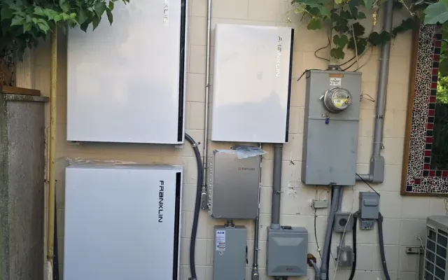Home batteries installed on a garage wall