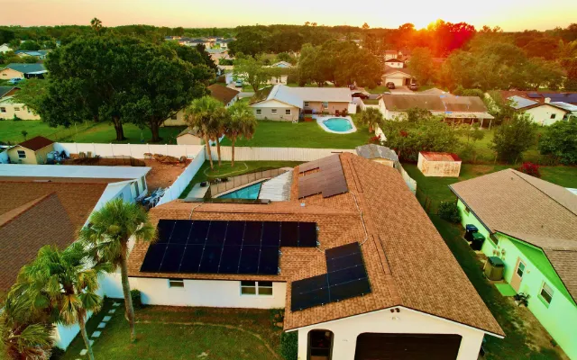 Aerial view of a solar home at sunset