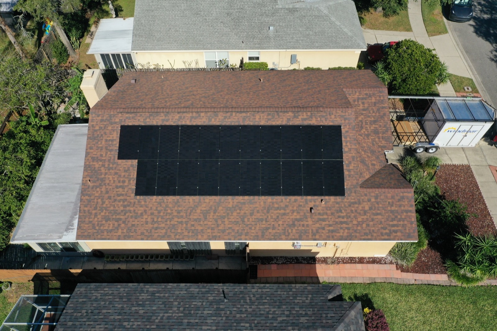 Solid-black rooftop solar array viewed from above