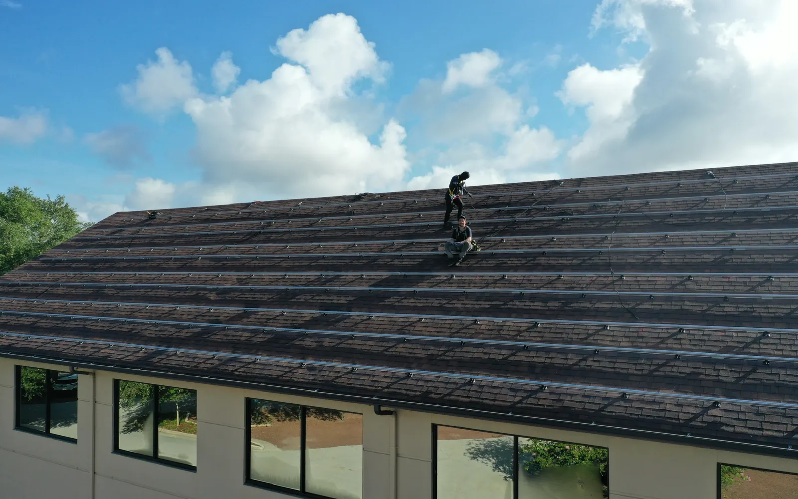 Sunstorm installers working on solar racking at St. Luke's