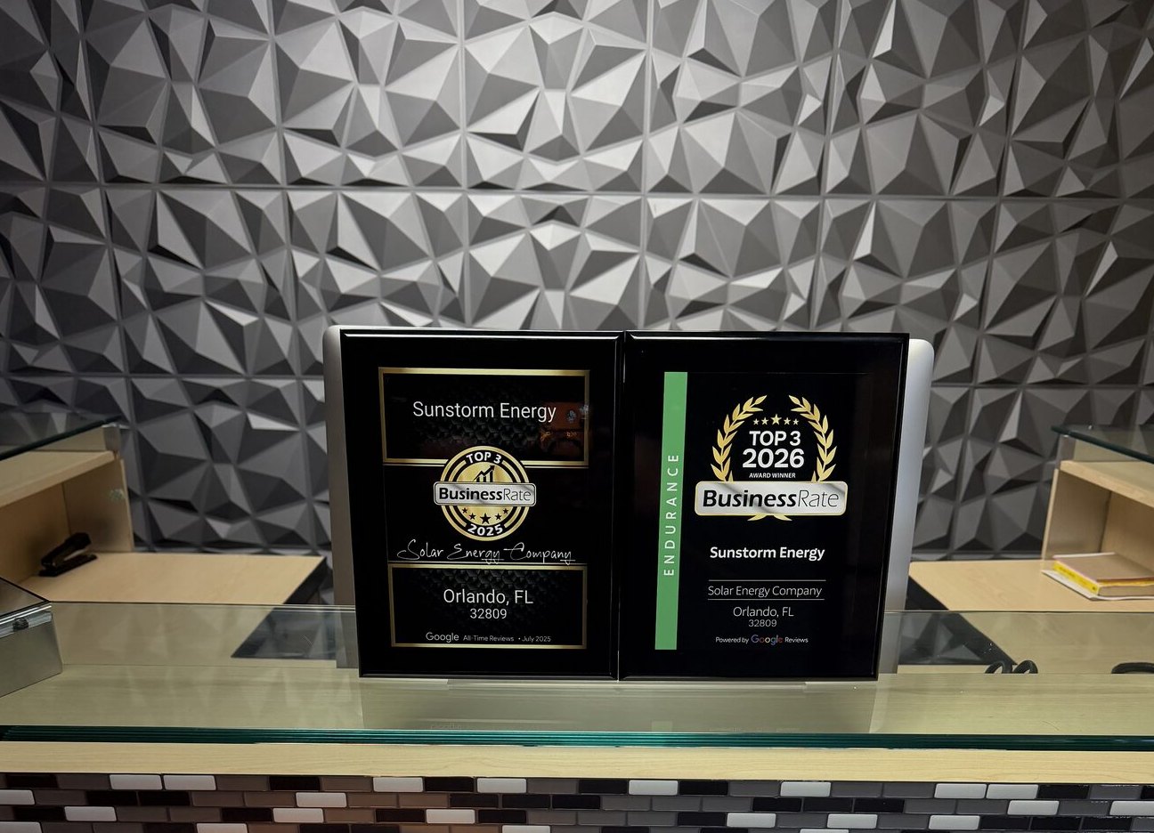 BusinessRate Top 3 solar company awards for 2025 and 2026 at the Sunstorm Energy office