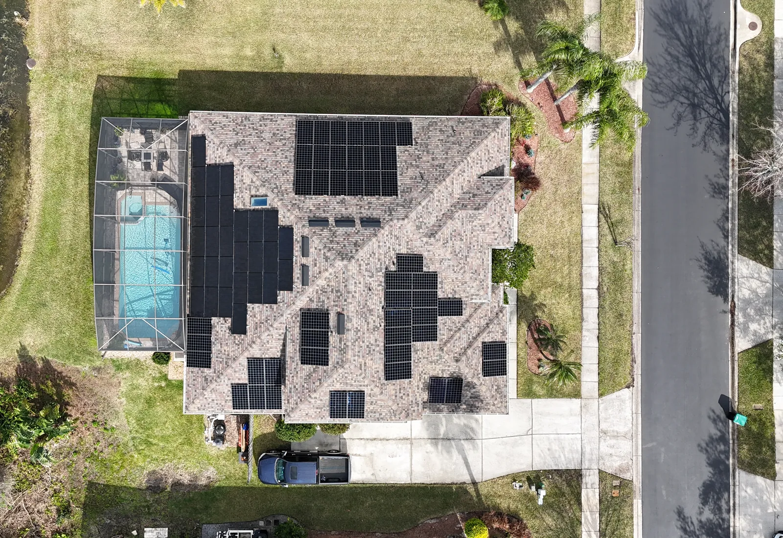 Aerial view of an all-black Sunstorm Energy solar installation on a Central Florida home