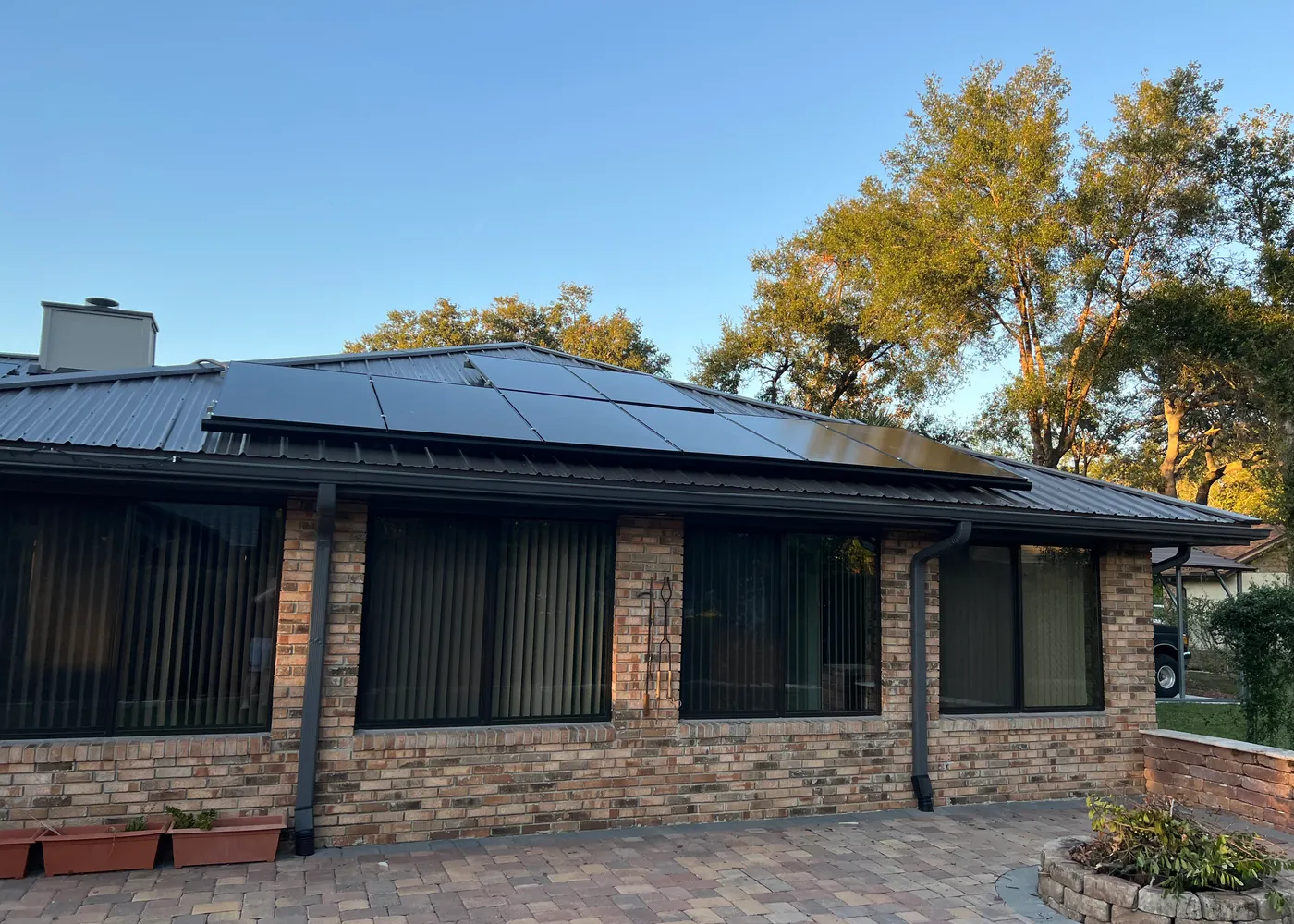 All-black solar panels installed on a metal roof in Central Florida