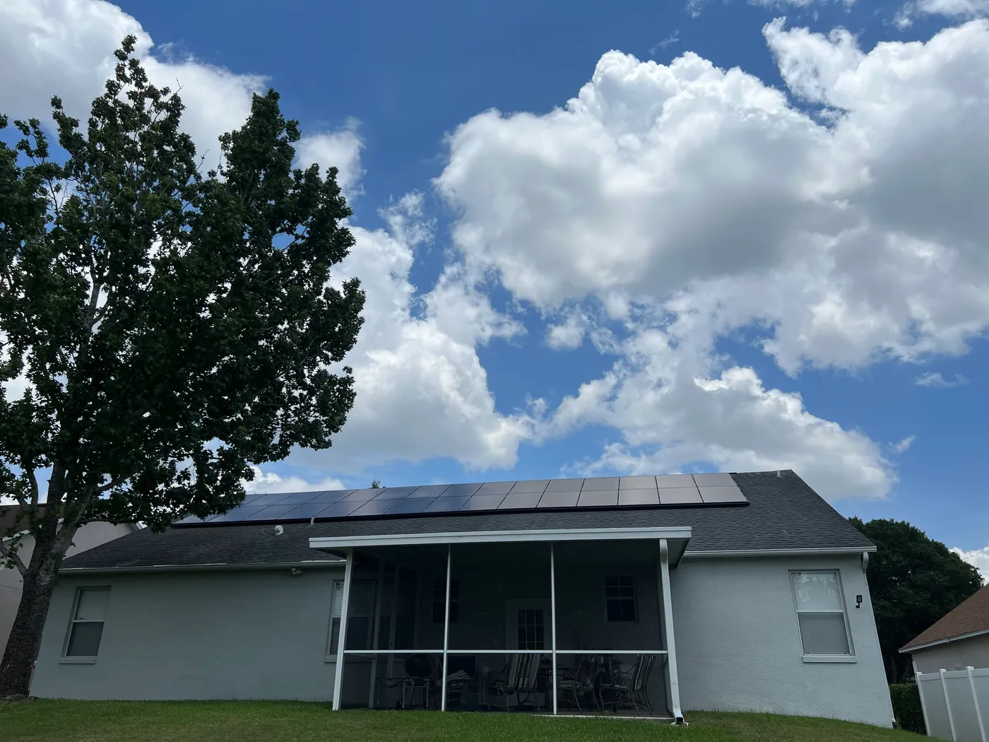 Long all-black solar array across the rear roof of a Central Florida home