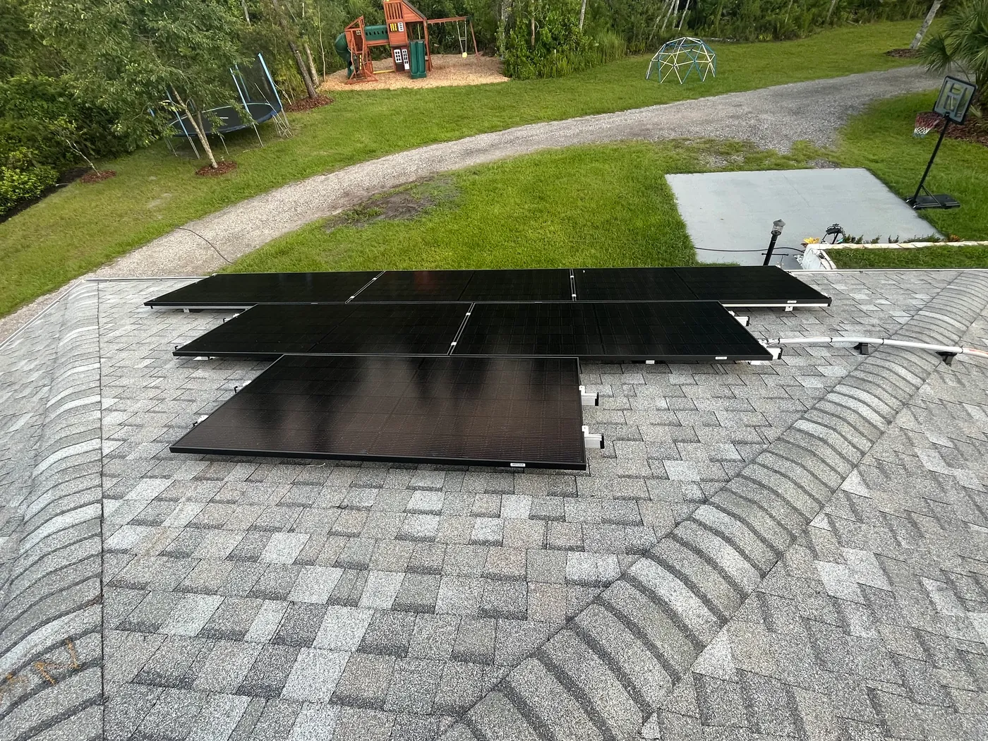 Close view of a finished all-black rooftop solar installation